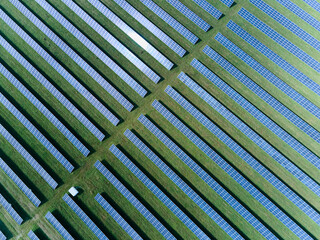 Solar panels in aerial view. Blue solar panels. background of photovoltaic modules for renewable energy