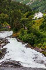 Hellesylt Fossen waterfall in area Geirangerfjord in village Hellesylt
