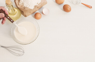 dough in glass plate and products for its preparation on  white background