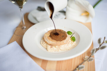 Tiramisu is a coffee-flavoured Italian dessert. It is made of ladyfingers dipped in coffee, layered with a whipped mixture of eggs, sugar, and mascarpone cheese, flavoured with cocoa. 