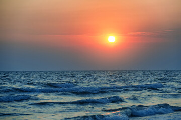 Picturesque sky with sun over sea at sunset