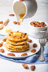 Gluten Free Pancakes with Pecans Pouring Maple Syrup