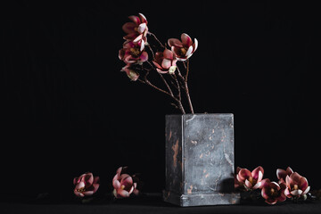 Magnolias in an elegant stone vase, used for funerals and funeral service.