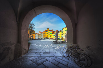 Lucca, Piazza dell' Anfiteatro square from entrance arch. Tuscany, Italy - obrazy, fototapety, plakaty