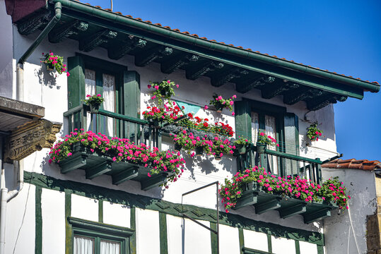 Hondarribia, Spain - 29 Aug 2021: Traditional Basque houses in the cobble stone streets of old town Hondarribia