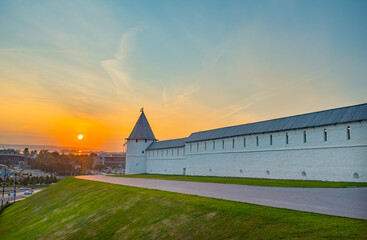 Kazan Kremlin in summer evening. Tatarstan, Russia. Nice view of white wall and Volga river on the...