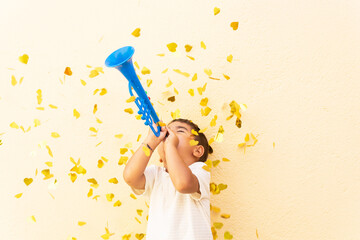 Excited boy playing trumpet toy