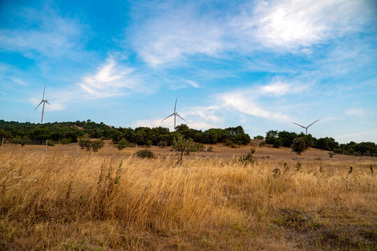 wind mills with couldy sky