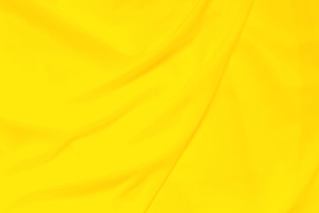 Soft focus yellow smooth ripple linen fabric texture background, yellow is the color trend of 2021 that represents freshness, vitality, optimism and hope