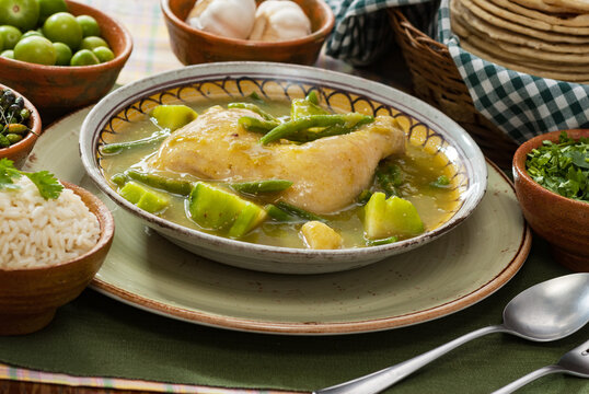 "joc&oacute;n" traditional dish of Guatemalan gastronomy, with green sauce, vegetables, rice, and tortillas.