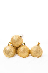 Christmas golden balls for Christmas tree decoration on white background, Christmas toys,  copy space