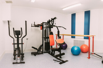 Fototapeta na wymiar Room With Modern Exercise Equipment. Fitness Center Interior. Panorama. Panoramic View
