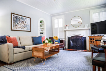 A clean and classic airy living room of a small cottage short term rental
