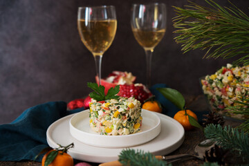 New Year's holiday salad with mayonnaise, New Year's table, champagne