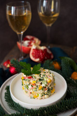 New Year's holiday salad with mayonnaise, New Year's table, champagne