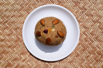 Churma ladoo or atta laddoo made from wheat flour, jaggery and ghee. Big size sweet for religious offering to lord ganesha for ganesh chaturthi festival and all festival celebrations