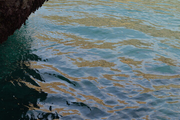 Light reflected off the sea at Kynance Cove Cornwall