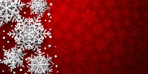 Christmas background of paper snowflakes with soft shadows, white on red background with falling snow