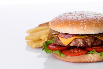 Craft beef burger and french fries on a white background