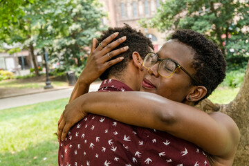 Close-up of couple embracing in park
