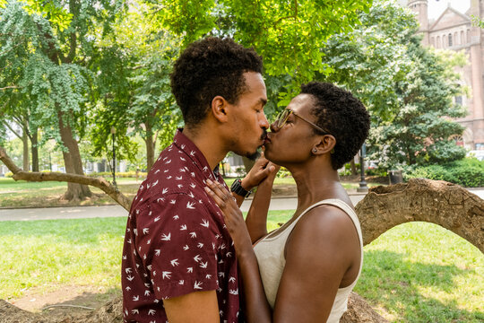 USA, Couple kissing in park