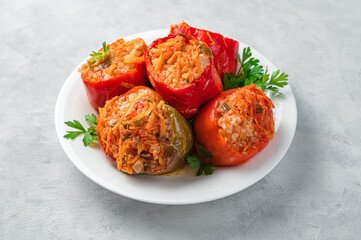 Stuffed pepper close-up on a gray background. Bulgarian pepper stuffed with meat, rice and vegetables.