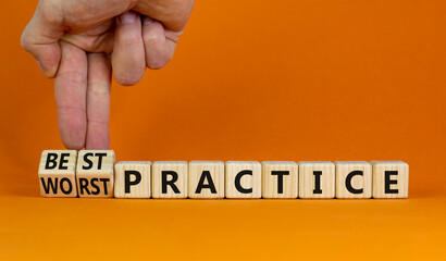 Best or worst practice symbol. Businessman turns wooden cubes and changes words 'worst practice' to...