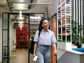 Woman walking in office hallway