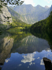 Fototapeta na wymiar Obersee lake with the reflection of surrounding nature - Berchtesgaden Alps, Germany