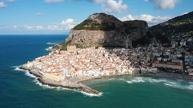 Cefalu, Sicily, Italy - drone shot of the cityscape while sunset.