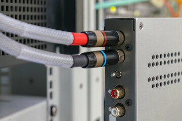 The multimedia equipment works in the server room. The AV cables are connected to a digital amplifier. The digital signal converter is in the rack.