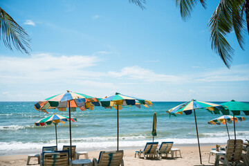 Umbrella and chairs colorful to sleep and relax on the beach.
