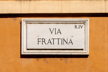 marble plate with Street name via Frattina - engl: Fattina street - painted at the wall in Rome
