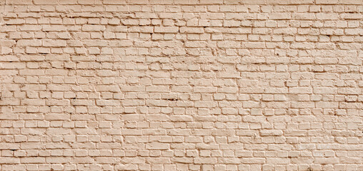Brick wall painted with beige hard hat. Panoramic background of wide texture of cream brick wall. Background for home or office.