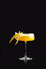 Summer Cocktail - Pornstar Martini. Drink with Passion fruit, Vodka, Liqueur, Vanilla Syrup, Champagne and Lime Juice. Black Background