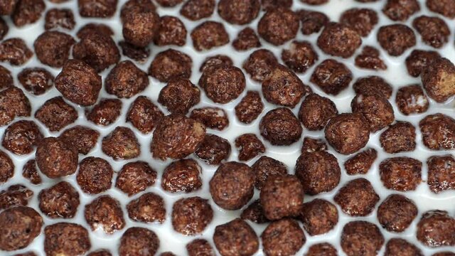 Chocolate balls in milk. A quick and healthy breakfast. A dry Breakfast.