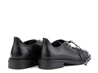 A pair of classic leather elegant men's shoes isolated white background. Groom's stylish black shoes. Isolated object close up on white background. Back side view.