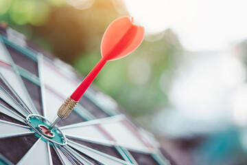 Business marketing success concept. Red dart arrow in center of the target dartboard. Bullseye is a target of business.