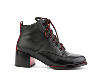 Women's autumn black leather jodhpur boots with red laces and average heels, isolated white background. Right side view. Fashion shoes. Photoshoot for shoe shop concept.