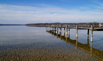 a wooden pier on lake Ammersee in Germany