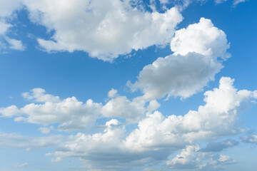 Cirrus and cumulus clouds on blue sky background..