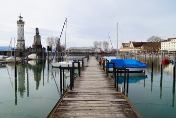 Fototapeta premium Wintertime at the beautiful harbour of Lindau city on lake Constance (Germany)