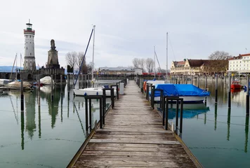 Fotobehang Wintertime at the beautiful harbour of Lindau city on lake Constance (Germany) © Julia