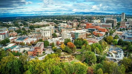 Aerial panoramic view of downtown Greenville, SC buildings under cloudy sky - obrazy, fototapety, plakaty