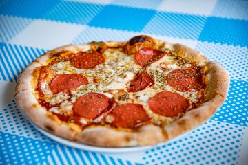 Traditional italian pizza pepperoni with salami and cheese. Italian cuisine.