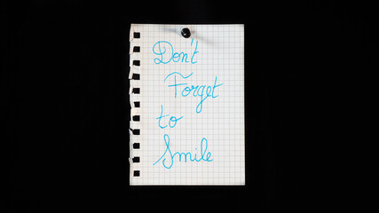 Hand written message on a ripped notebook sheet, 