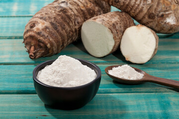 Taro Root of Colocasia esculenta and Organic Taro Flour in a bowl