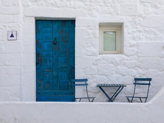 Romantic outdoor corner in ancient town of Ostuni, Puglia, Southern Italy - obrazy, fototapety, plakaty