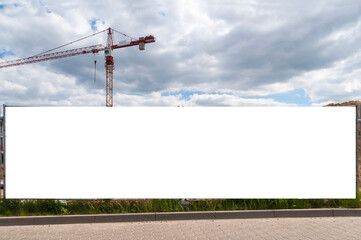 Blank white advertising banner on the construction cite fence