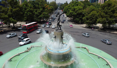 Drivers navigate by the iconic monument Diana the Huntress, Diana Cazadora, located in Paseo de la...